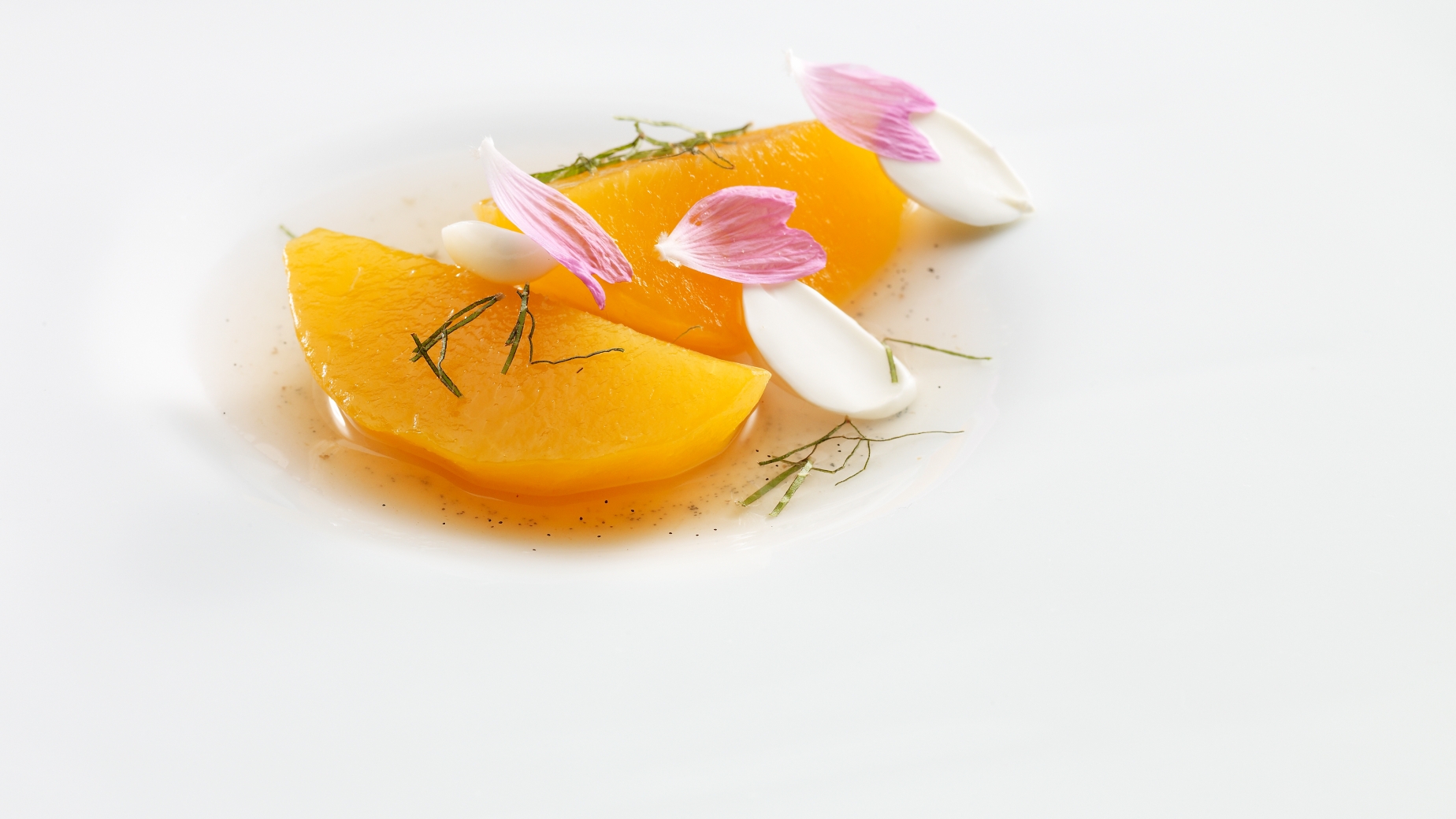 Segments of red peach,  almond essence and soup of white flowers.
PHOTO: José Luis López de Zubiría / Mugaritz